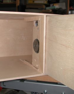 Detail view of the drive sprocket peeking through the drawer wall
